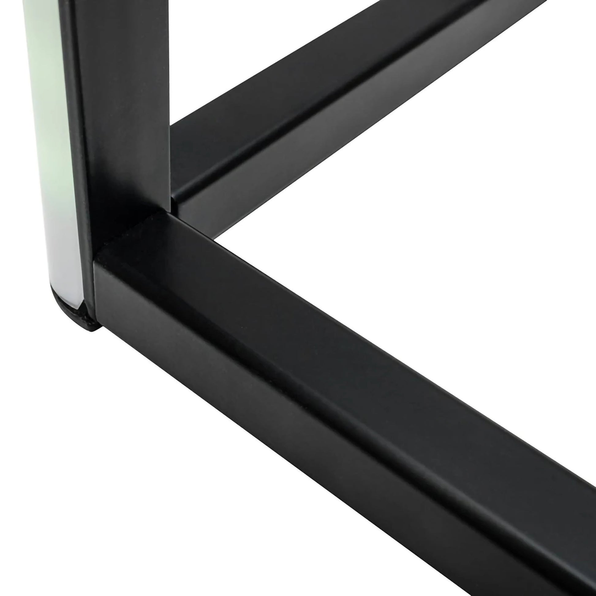 Close-up of a black metal frame corner on a white background of cornor lamp.