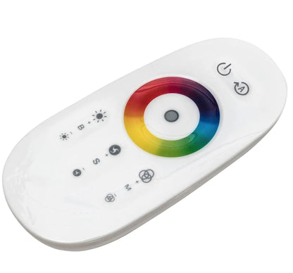 White remote control with color wheel on a white background of cornor lamp.